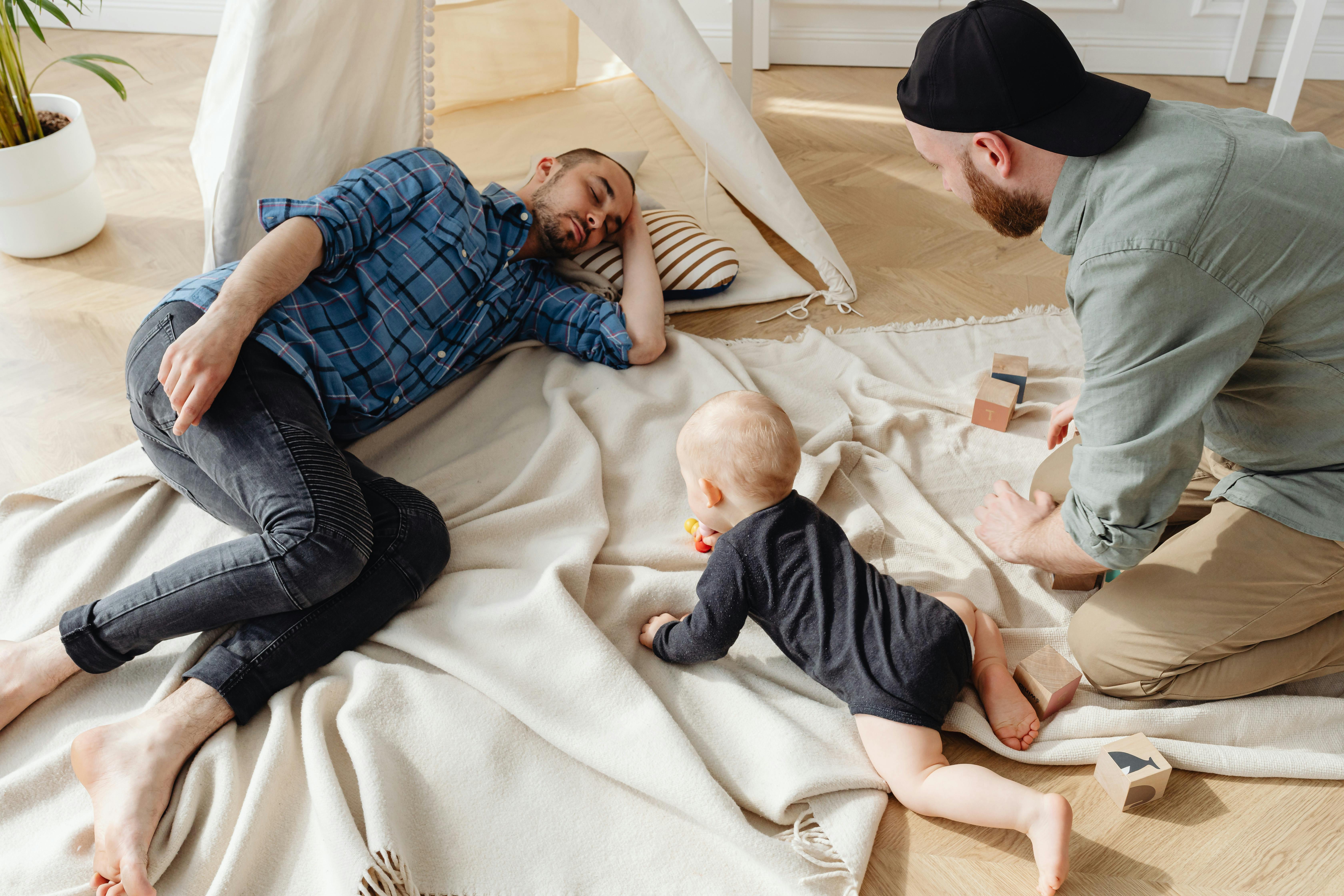 Parents playing and spending time with their small baby